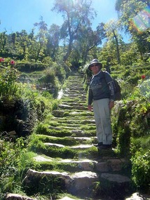 T still smiling as he climbs the Inca staircase