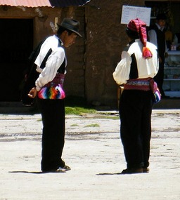 Men in traditional clothes, Taquille