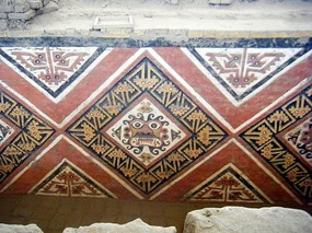 Unrestored - preserved by further walls