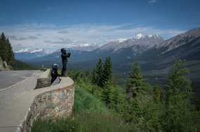 Kid and Dad bikers taking photos in Kootenay Park