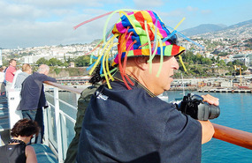 Funny hat man is glad to see land.