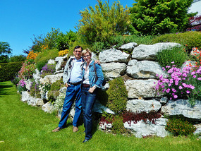 Jim and Romy in her beautiful front yard