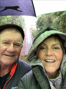 We’re standing in the rain,  getting soaking wet!