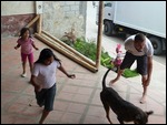 Junior playing football with the locals