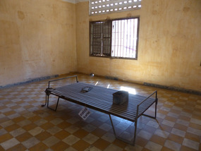 A torture cell and bed, with leg irons
