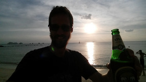 Ken enjoying the beach and a beer