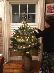 Peter decorating the Christmas tree