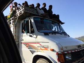 People on the top of a truck