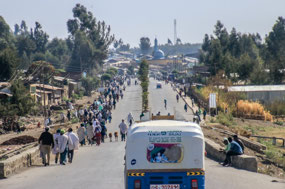 Procession of people walking to the markets