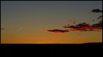 Sunset from our site with contrail