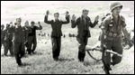 American-Japanese soldier leading German POWs