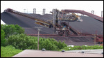 Taconite being loaded onto a ship.