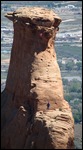 Man in blue below and woman above in red