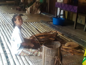 A VILLAGE WOMAN WORKING