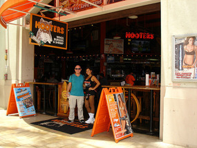 Richard with barmaid at Hooters
