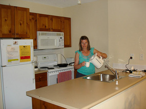 Having cup of coffee in kitchen