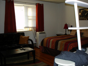 Combined bedroom and lounge of unit