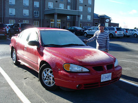 Richard scraping ice of Pontiac