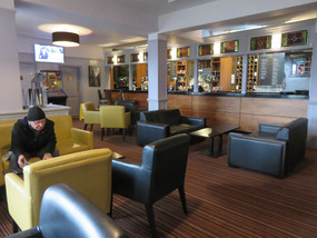 Richard reading paper in Lounge Pub