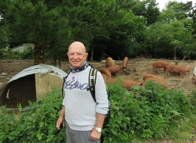 Richard walking through the farm yards