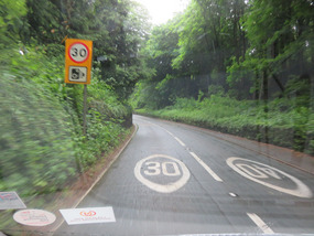 Speed cameras on the winding road in the woods