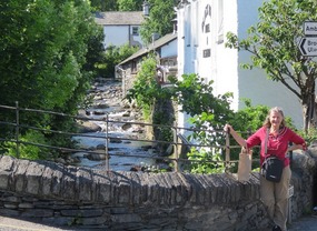 Standing by bridge over stream in Coniston