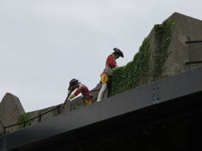 Statues of soldiers on wall of castle