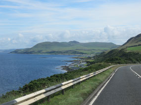 View of rocky coastline & mountains
