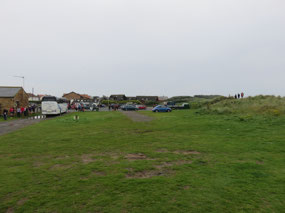 Coach loads of marathon runners at Beadnell Beach