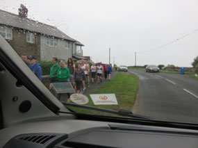 Runners going to beach from outer carpark
