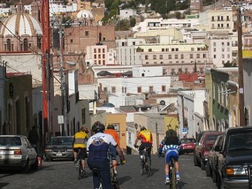 - colourful cycling jerseys against the "centro"
