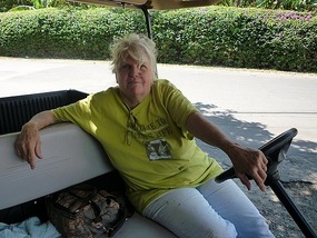 - expat Mindy arriving in her golf cart