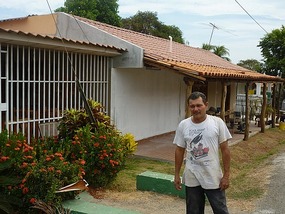 - Jose in front of house