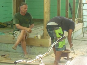 - Ari teaching his son the skills of carpentry