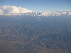 Snow Mountain Peaks above Desert