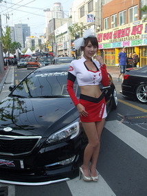 Model Poses with Car