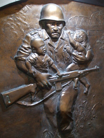 Soldier Saving Children