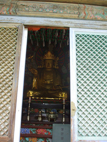 Gold Buddha Thru Doorway