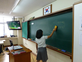 Students Erase Board at End of Class