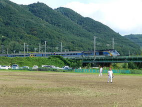 Mugunghwa Train Passes Field 