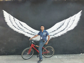 Posing by the Giant Wings