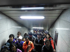 Crowd Waits on Stairs