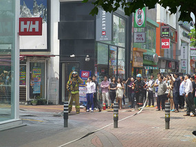 Onlookers Watch Firemen