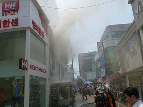 Smoke Shoots Out Window