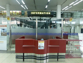 Giant Tourist Info Desk with Tiny Lady