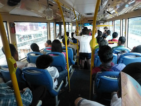 Backpackers Blocking City Bus