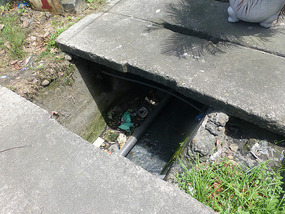 Walking on Sewage Drain Sidewalk