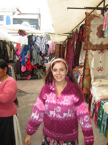 Me at the market trying on the local clothes