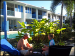 William Jayde playing cards around pool