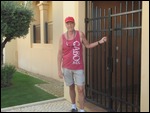 Cory leaving the gate to our apartment
